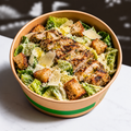 Grilled Herb Chicken Caesar Salad with Butterhead Lettuce, Anchovy Dressing, 36-Month Parmigiano Reggiano & Sourdough Croutons