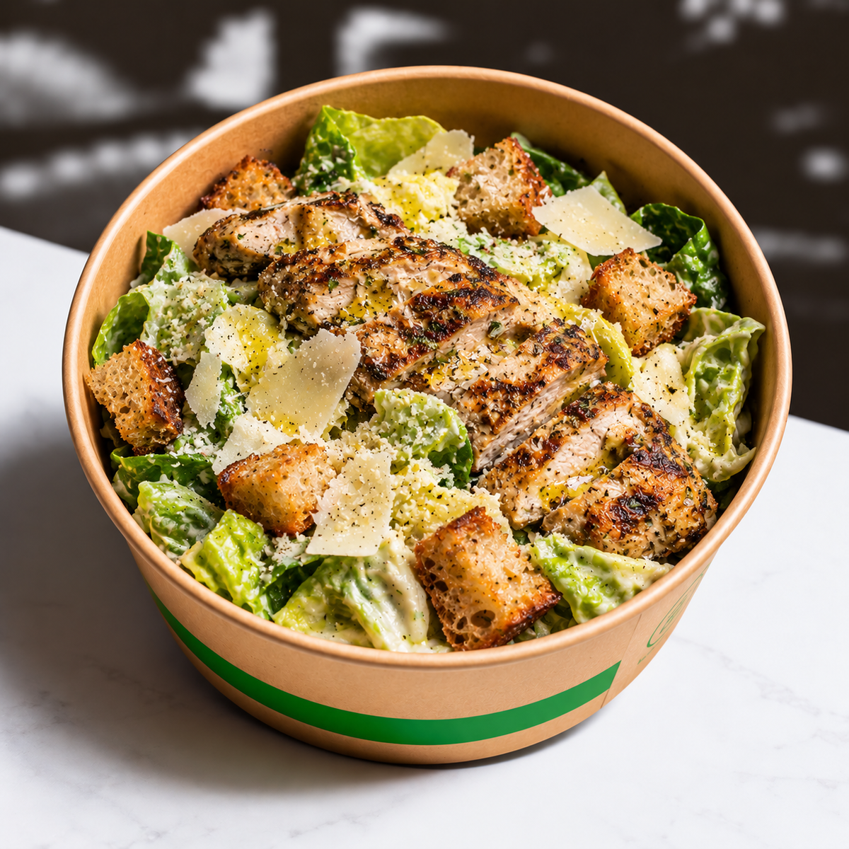 Grilled Herb Chicken Caesar Salad with Butterhead Lettuce, Anchovy Dressing, 36-Month Parmigiano Reggiano & Sourdough Croutons